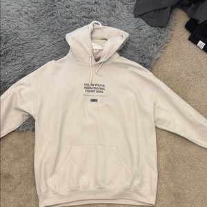 Cream Pullover Hoodie with Relaxed Fit and Ribbed Cuffs